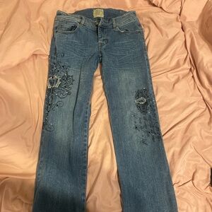 Medium Wash Blue Low RisStraight Leg Jeans with Distressed Floral Embellishments